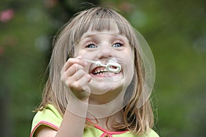 Girl blowing bubbles 4