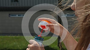 Girl blowing bubbles outdoor