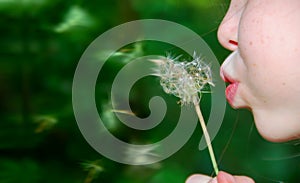 Girl Blowing Dandelion