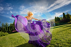 Girl in blowing dress Outdoors