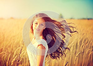 Girl with blowing hair enjoying nature