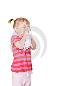 Girl is blowing her nose