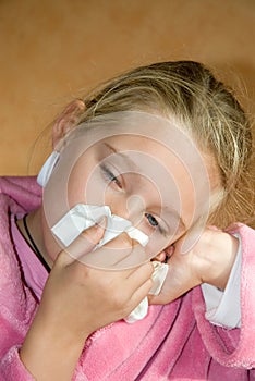 Girl blowing nose