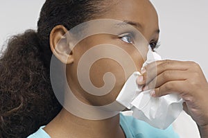 Girl Blowing Nose