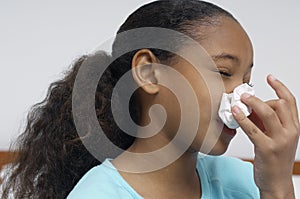 Girl Blowing Nose