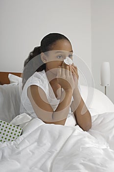 Girl Blowing Nose In Bed