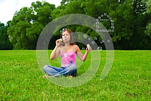 Girl blowing soap bubbles