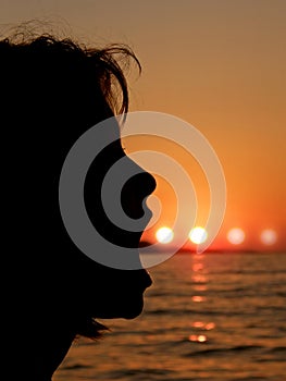 Girl blowing a sun bubbles