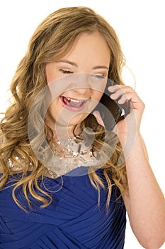 Girl blue dress laughing on phone