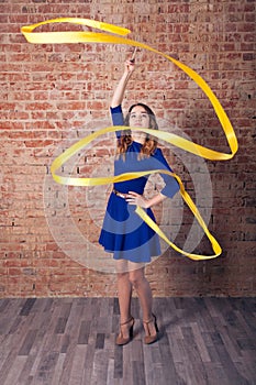 Girl with blue dress, yellow ribbon