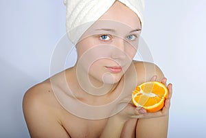 Girl with blue eye with towel on head