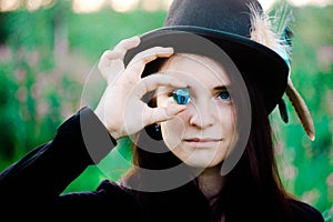 Girl with blue eyes holding a glass ball