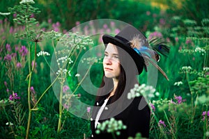 A girl with blue eyes in a top hat