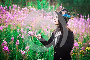 A girl with blue eyes in a top hat