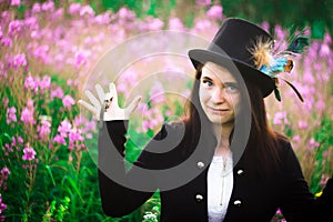 A girl with blue eyes in a top hat