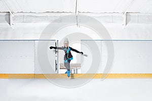 Girl in blue hat is going  for ice skating