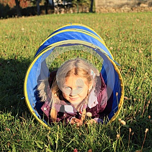 Girl in blue kids tunnel