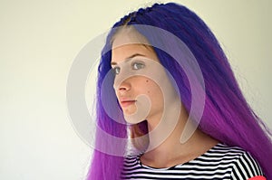 Girl with blue purple hair. Technique of hair extensions kanekalon nodular way