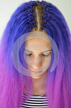 Girl with blue purple hair. Technique of hair extensions kanekalon nodular way