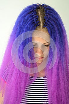 Girl with blue purple hair. Technique of hair extensions kanekalon nodular way