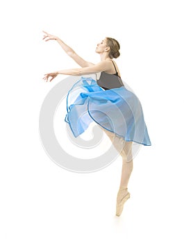 Girl in a blue skirt and a black leotard dance ballet