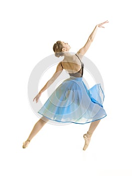 Girl in a blue skirt and a black leotard dance ballet