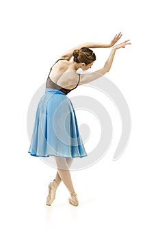 Girl in a blue skirt and a black leotard dance ballet