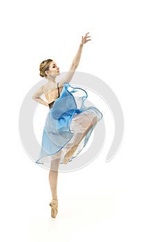 Girl in a blue skirt and a black leotard dance ballet