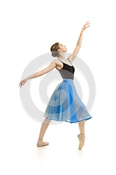 Girl in a blue skirt and a black leotard dance ballet