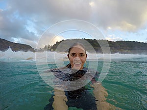 Girl bodysurfing in hawaii