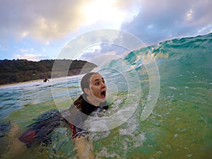 Girl bodysurfing in hawaii