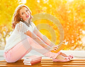 Girl with book in the garden