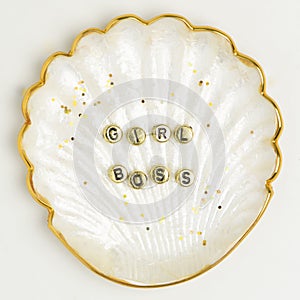 Girl boss beads typography on gold shell