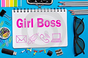 Girl Boss notes in a notebook on the Desk in the office. Business girl concept