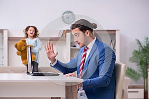 Girl bothering young father during working from house in pandemi