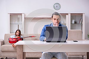 Girl bothering young father during working from house in pandemi