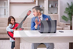 Girl bothering young father during working from house in pandemi