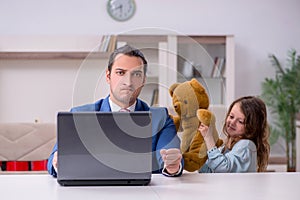 Girl bothering young father during working from house in pandemi