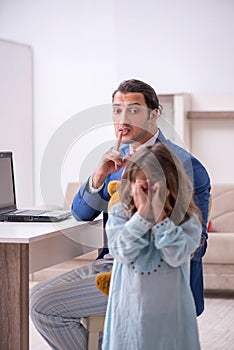 Girl bothering young father during working from house in pandemi