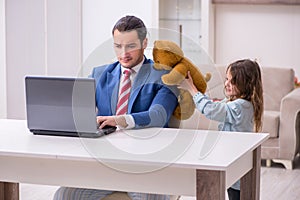 Girl bothering young father during working from house in pandemi