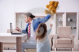 Girl bothering young father during working from house in pandemi