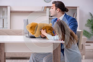 Girl bothering young father during working from house in pandemi