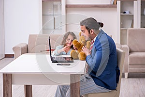 Girl bothering young father during working from house in pandemi