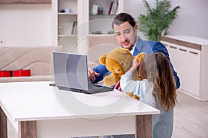 Girl bothering young father during working from house in pandemi