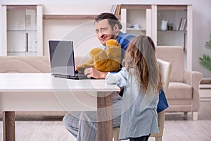 Girl bothering young father during working from house in pandemi