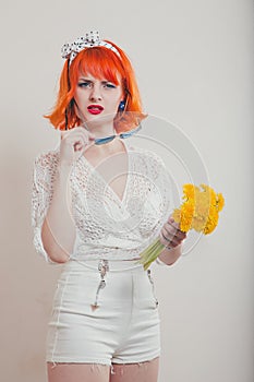 Girl with a bouquet of dandelions