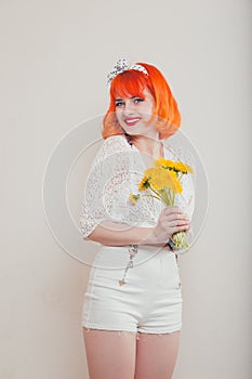 Girl with a bouquet of dandelions