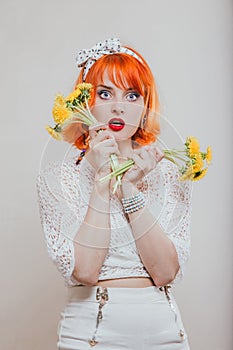 Girl with a bouquet of dandelions