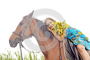 Girl with a bouquet of irises on a horse