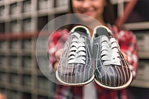 Girl with bowling shoes